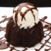 Molten Lava Cake · A rich chocolate souffle with a molten chocolate center served with warm chocolate sauce.