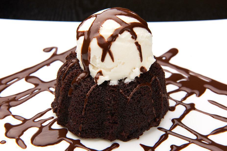 Molten Lava Cake · A rich chocolate souffle with a molten chocolate center served with warm chocolate sauce.