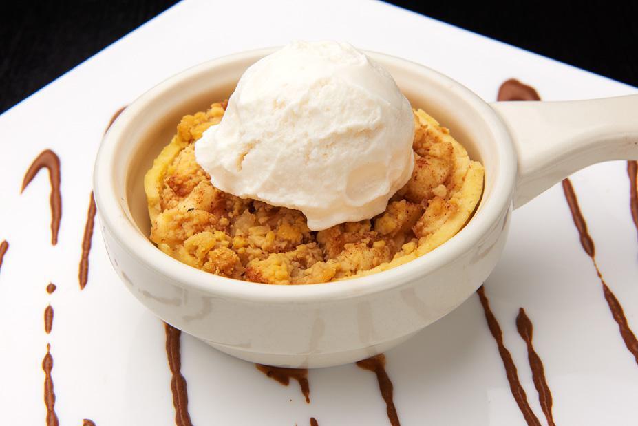 Apple Cobbler · A round fabolous shell complete with granny smith apples with vanilla ice cream.