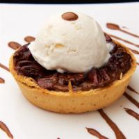 Chocolate Pecan Torte · Thin light crust topped off with roasted pecans in a caramel syrup and finished with divine ...