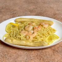 Shrimp Scampi  · Shrimp sauteed in garlic and butter, finished with a traditional white wine sauce and served...