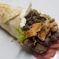 09. Mix Wrap صاج مشكل · Lamb, chicken, lettuce, onions, pickles. Choice of sauce.