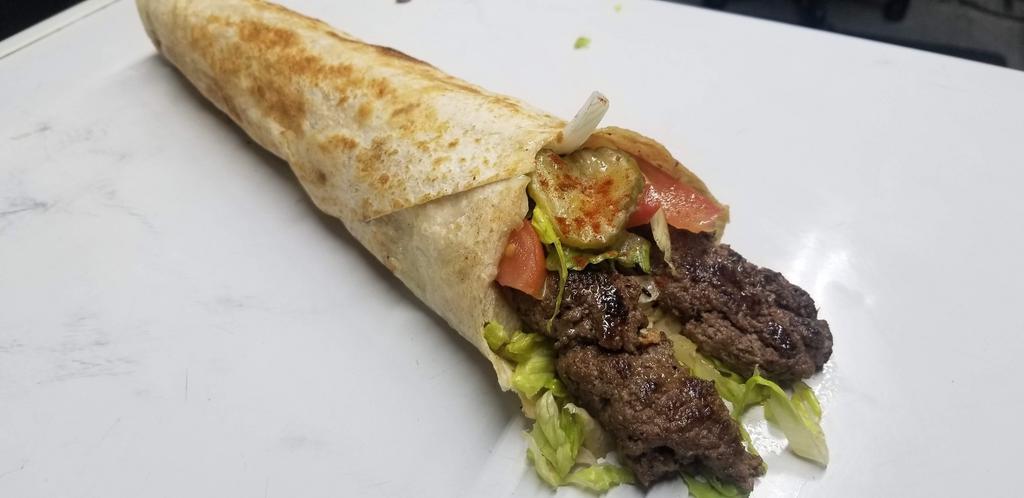 11. Shish Kabab Wrap -Beef صاج كباب لحم · Beef, tomato, onions, pickles, parsley. Choice of sauce.
