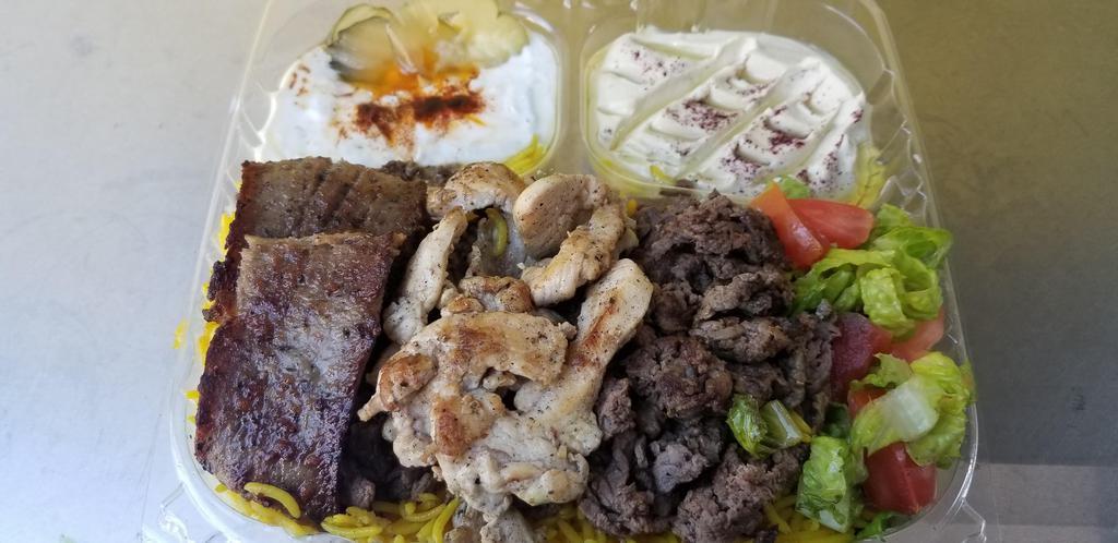 13. Trio-Plate  طبق مشكل .دجاج .لام .بيف · Beef, lamb, chicken, rice, salad, hummus, tzatziki, pita bread.