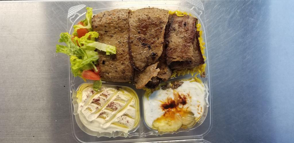 14. Lamb Plate  طبق لام · Saffron rice, salad, hummus, tzatziki, pita bread. Choice of sauce.