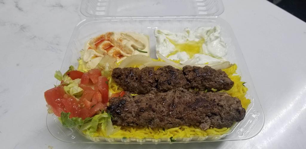 17. Beef kabab Plate طبق كباب لحم · Beef, saffron rice, salad, hummus, tzatziki, pita bread. Choice of sauce. 