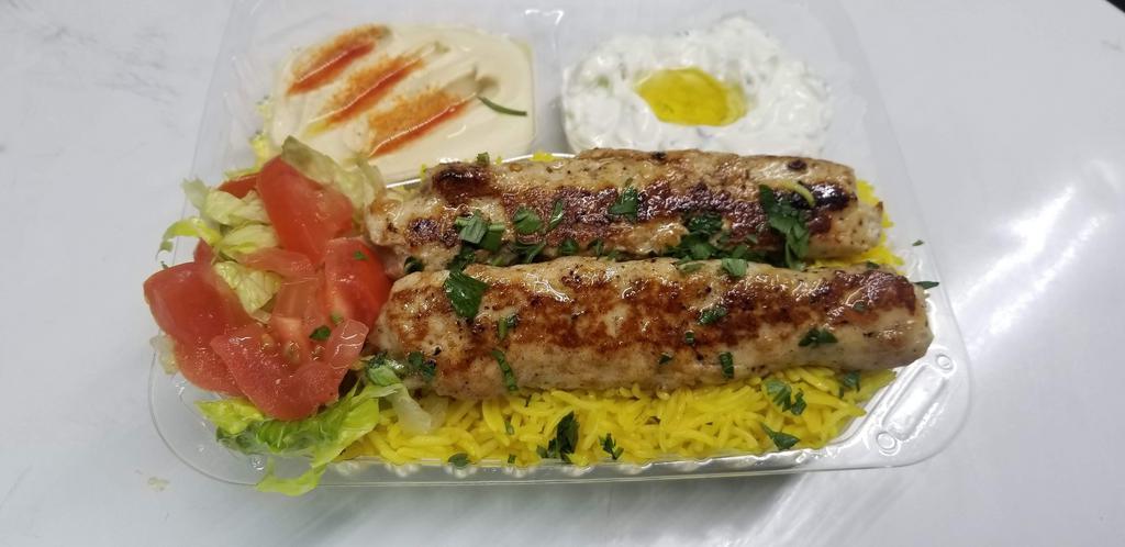 18. Chicken Kabab Plate طبق كباب دجاج · Chicken saffron rice, salad, hummus, tzatziki, pita bread. Choice of sauce.