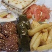 20. Mezza Plate طبق مازا · Falafel, dolma, french fries, hummus, tzatziki, pita bread, salad, tahini sauce.