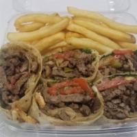 23. Beef Saj Arabi صاج عربي لحم · Beef, pickles, onions, parsley, tomatoes, French fries. Choice of sauce.