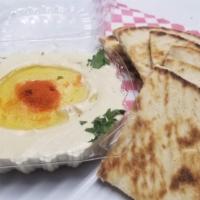 25. Hummus with Pita  حمص مع خبز · Hummus, pita bread.