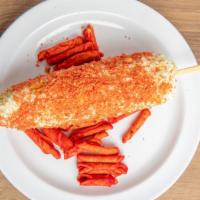 Elote Loco · 
corn on the cob with mayonnaise, cotija cheese and ground takis
