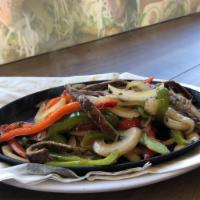 Fajitas · Choice of protein mix with onions, green and red peppers. Served with three flour tortillas ...
