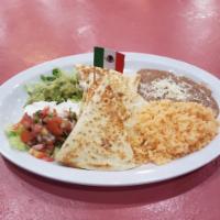 Maggie's Quesadillas · Choice of mushrooms, chicken, steak, spicy pork, or tinga in a 10