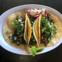 Carne Asada Taco · (1)Steak. Made on double corn tortilla topped with cilantro and  onions. Radishes and lime o...