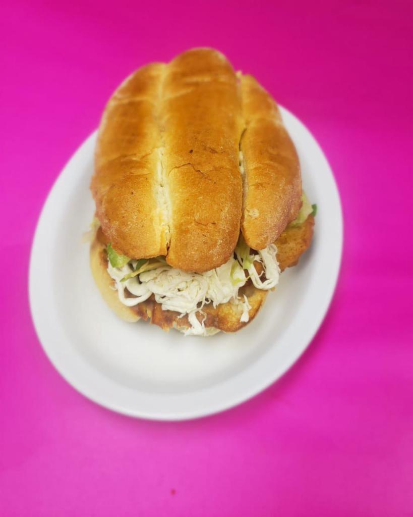 Torta Milanesa de Res  · Breaded steak. Mexican style sandwich (Telera) roll with refried beans, lettuce, tomatoes, onion, Oaxaca cheese, avocado, jalapeños and mayonnaise.