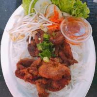 Grilled Pork Vermicelli · Pork cooked on a rack over a grill.