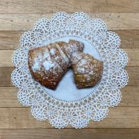 Sfogliatelle · A baked shell-shaped pastry with a ricotta cheese filling.
