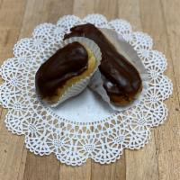 Chocolate Eclair · Oblong pastry made with choux dough filled with a vanilla custard and topped with chocolate ...
