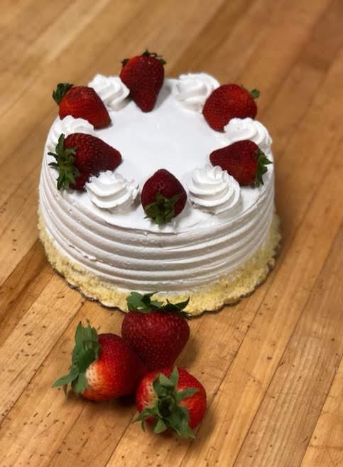 Strawberry Shortcake · American Cake (yellow), cut into 3 layers in between 2 layers of whipped cream and strawberry filling. Whipped Cream with fresh strawberries on top.