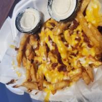 Cheese Fries · Cheddar-Jack cheese & Bacon bits served with a side of bacon ranch.