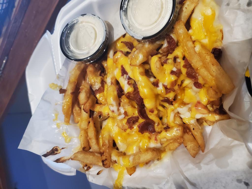 Cheese Fries · Cheddar-Jack cheese & Bacon bits served with a side of bacon ranch.