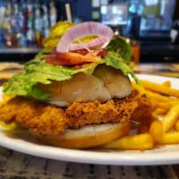 The Village Chicken Sandwich · Your choice of grilled or fried chicken breast topped with mayo, lettuce, tomato, onions and...