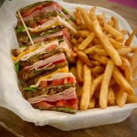 Chief's Club Sandwich · Triple stack piled high with ham, turkey, bacon, lettuce, tomato, cheddar & Swiss cheese wit...