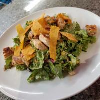 Southwest Chicken Salad · Mixed greens, Southwest seasoned chicken, tomato, corn, black beans, red onions, topped with...