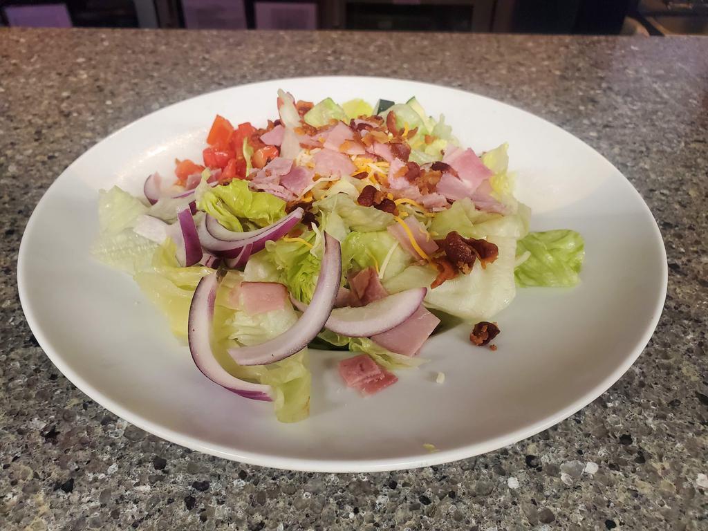 Hook -N- Ladder · Mixed greens, ham, bacon, cheddar cheese, red onion, cucumber, tomatoes, & croutons. Served with your choice of dressing.