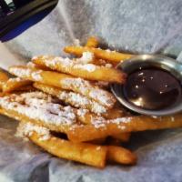 Funnel Cake Fries · Powdered sugar, raspberry and chocolate sauce on hot funnel cake fries.