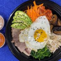 Bibimbap Bowl · Sliced beef, rice, egg, mushroom, carrot, avocado, boiled sprouts, kimchi, sesame seeds, ses...