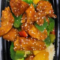 Sesame Chicken · Deep fried chicken, sesame sauce, sesame seeds, served with broccoli, scallion and carrot.