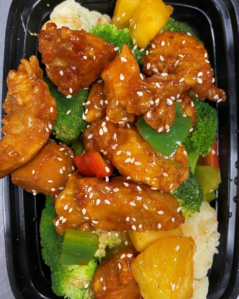 Sesame Chicken · Deep fried chicken, sesame sauce, sesame seeds, served with broccoli, scallion and carrot.