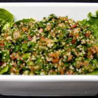 Tabouli Salad · Vegetarian. Cracked “bulgur” wheat, tomato, parsley, onion, fresh lemon and virgin olive oil.