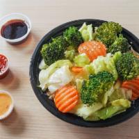 Buddha  · Vegetarian bowl consisting of cabbage, carrots and broccoli.