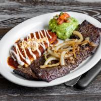 Tampiquena · Skirt steak topped with sauteed onions, served with red sauce cheese enchilada, crema, guaca...