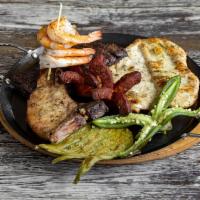 Parrillada Jalapenos · Churrasco, chicken, pork chop, Mexican sausage, grilled shrimp, cactus & jalapeno, served wi...