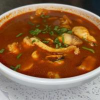 Sopa de Mariscos · Shrimp, calamari, mussels, clams & fish in delicious fish broth, served with rice. 