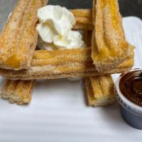 Churros · Fried pastry dusted with cinnamon sugar.