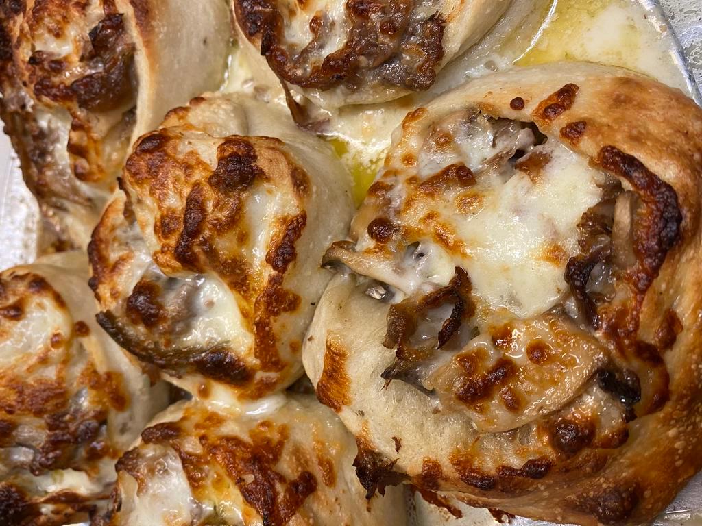 6 Philly Cheesesteak Pinwheels  · Freshly baked pizza dough smothered with mozzarella cheese, roasted beef, sautéed Onions & Peppers , Mushrooms, garlic aioli, & American Cheese.  