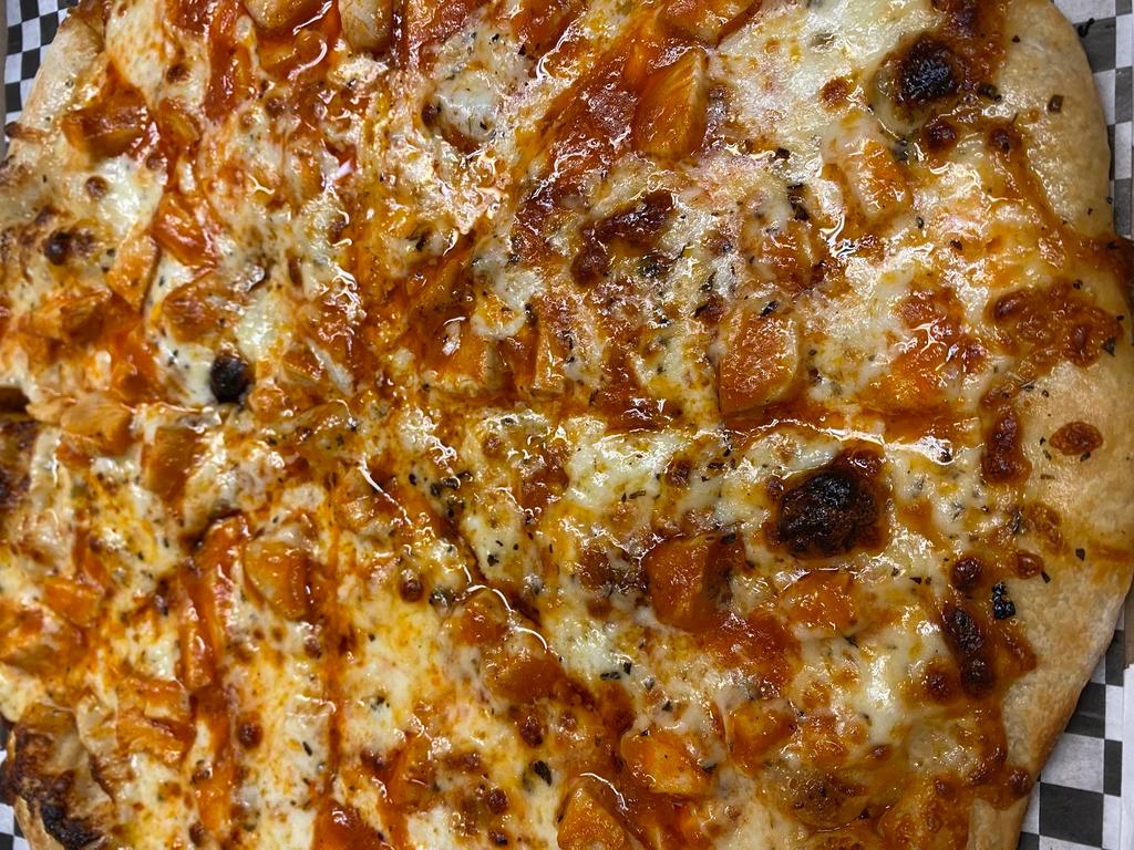 16” Chicken Wing Pizza  · Homemade bleu cheese dressing covers this fresh dough pizza, topped with mozzarella, chicken tender pieces, & our own hot sauce, 