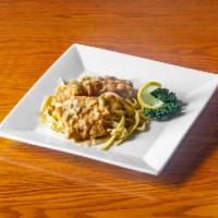 Chicken Francaise · Egg battered and sautéed chicken breast in a lemon wine - garlic sauce over house made fettu...