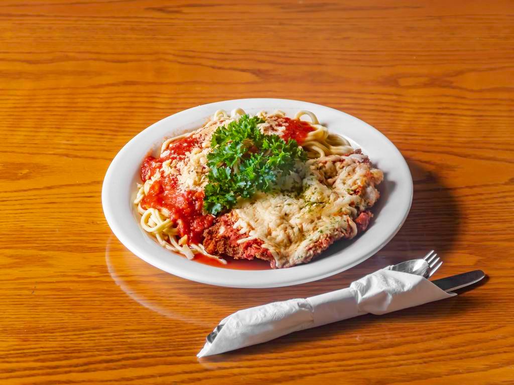 Chicken Parm · Breaded and fried chicken breast in our homemade marinara with mozzarella. Served with spaghetti.
