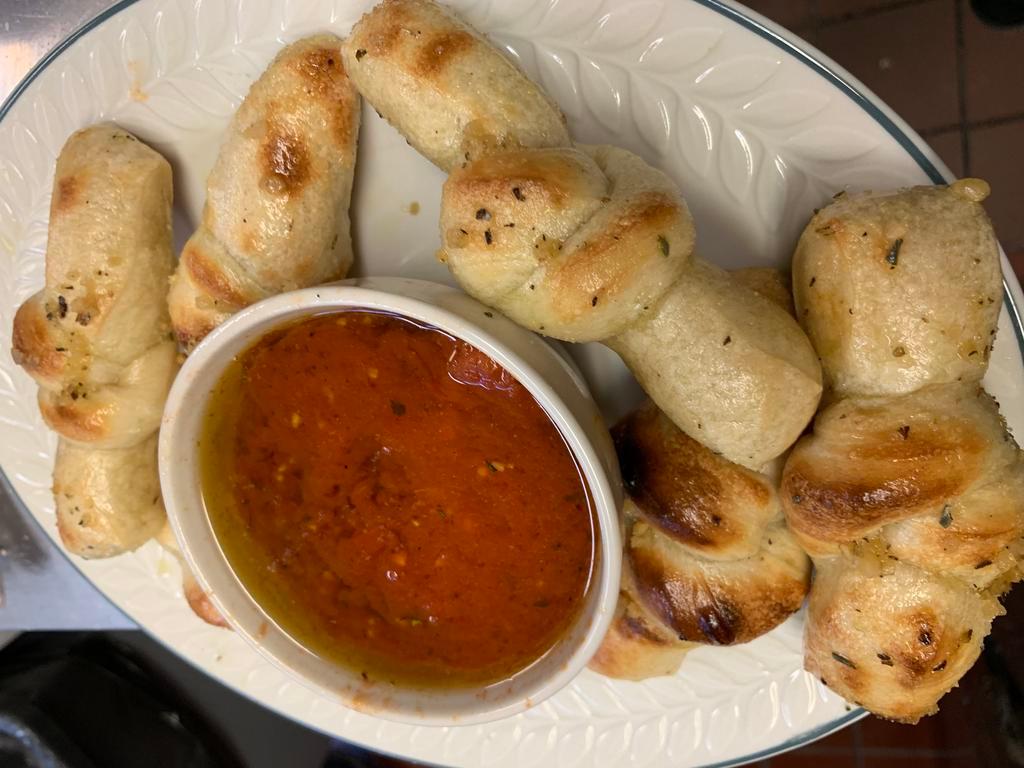 6 Garlic Knots · Garlic bow ties served with our in olive oil garlic sauce served with side of spicy marinara.