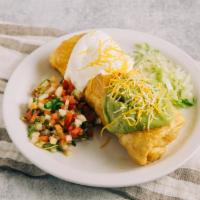 Beef Chimichanga · Shredded beef mixed with onion and bell pepper deep fried burrito with beans, cheese inside ...