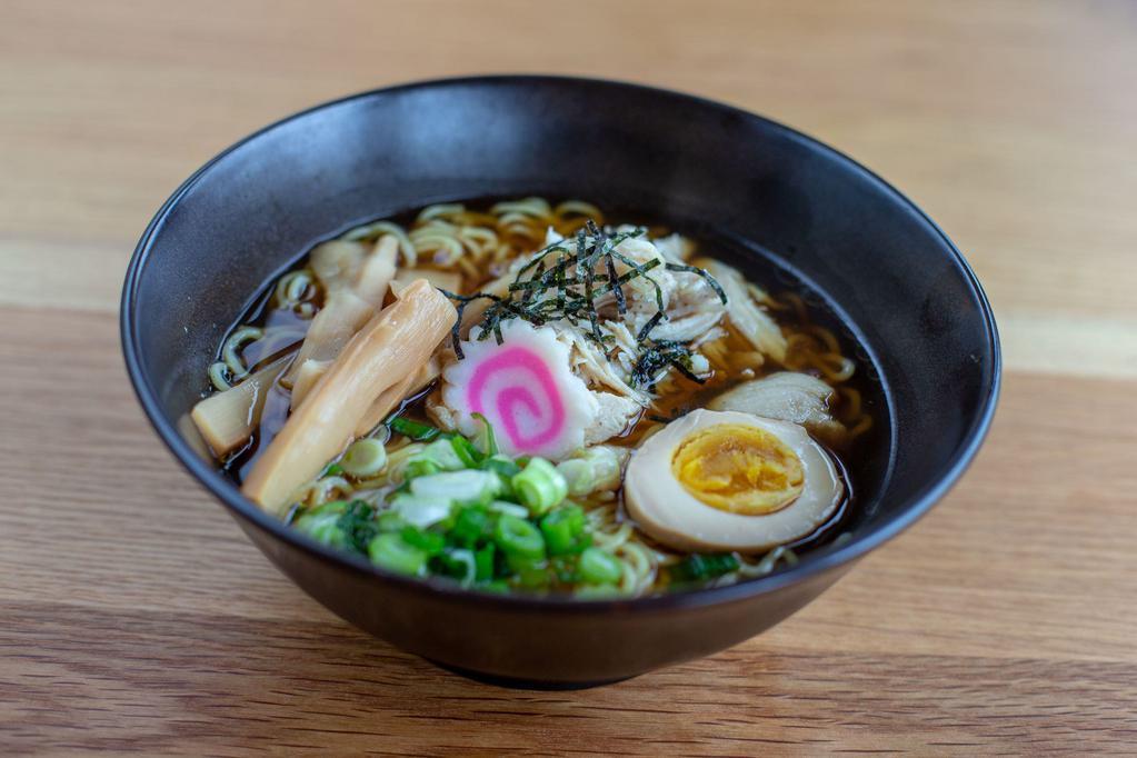 Chicken Shoyu Ramen Bowl · Wavy noodles in our special shoyu broth topped with steamed chicken, scallions, bamboo shoots, kikurage mushrooms, fish cake and half boiled egg.