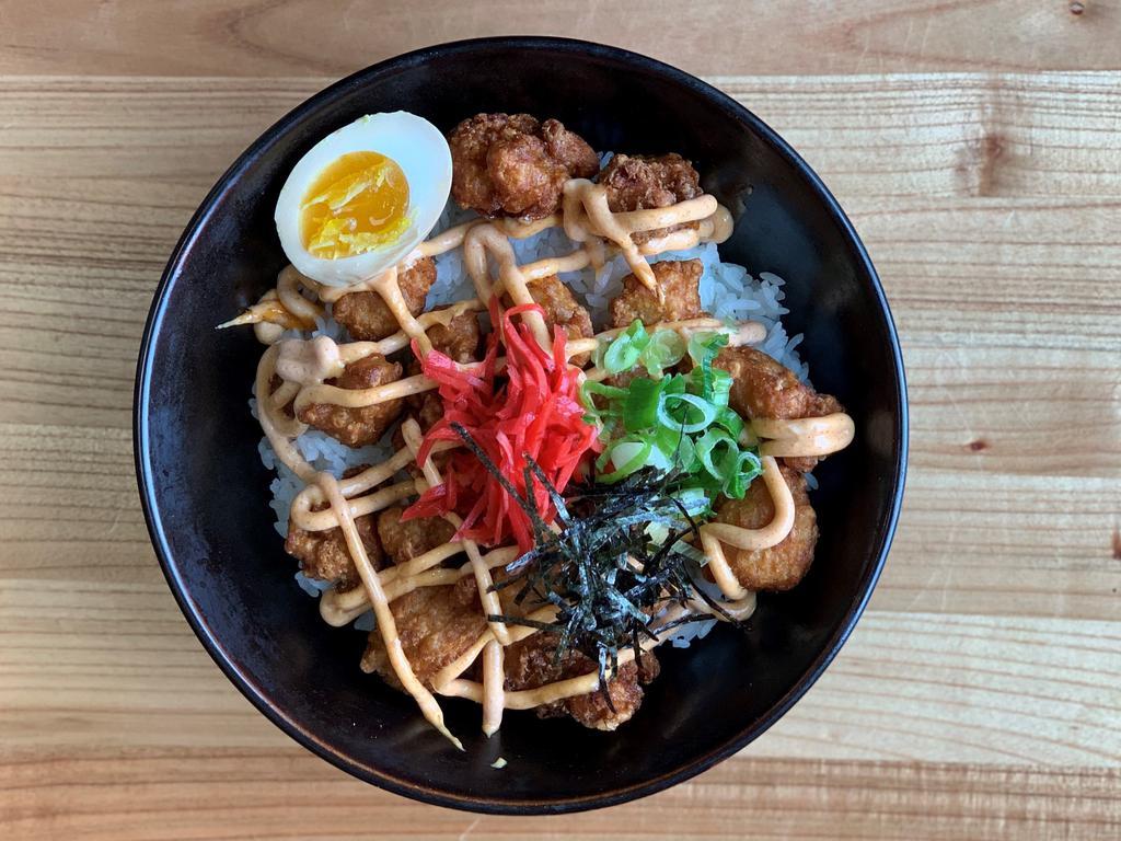 Chicken Karaage Rice Bowl · Asian style chicken nugget seasoned with ginger, garlic, soy sauce and together with half boiled egg, scallion on top of white rice.