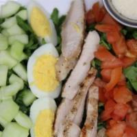 Cobb Salad · Garden Fresh Romaine, tomatoes, cucumbers, avocados, bacon, grilled chicken, and shredded ch...