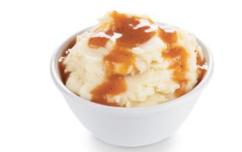 Mashed Potato with Gravy · For us, no meal is complete without Mashed Potatoes & Gravy. So, of course, we had to add it to our offerings. Our potatoes are light and fluffy, and our gravy is the secret that makes it magical.