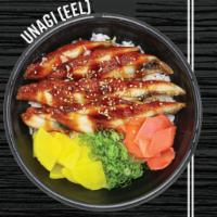 Unagi （eel ）rice box 鳗鱼盖饭 · Broiled eel, served with sesame seeds, eel sauce, picked radish, ginger, and green onion